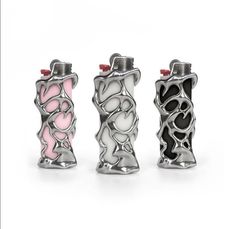 three lighters with hearts on them are lined up in the shape of heart shapes