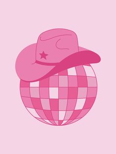 a pink hat is sitting on top of a ball with a star in the middle