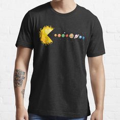 a man wearing a black t - shirt with the word pokemon on it