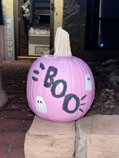 a pink pumpkin with boo written on it