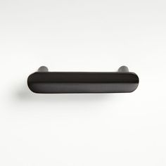 a black handle on a white wall