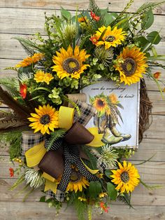 a wreath with sunflowers and an old book