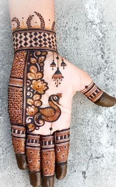 henna tattoo on the palm of someone's hand