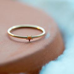 A 14k gold-filled simple stacking ring inspired by glittering stars! It feels classic yet playful. Perfect as a friendship ring/holiday gift and easy to be stackable and versatile. A fabulous everyday ring!DETAILS:☆ Crafted in 14K Gold-Filled. Nickel free.☆ High Quality Ring that lasts its color and beauty over time.☆ 1/25 in or 1mm wide each.☆ Comes beautiful packaged, in our branded Jewelry Box. Gift Ready.☆ 3 sizes available: US 6, 7, 8.☆ US size:  Inside diameter in ''· US 6:  (0.65'')· US 7 Gold Star-shaped Everyday Rings, Minimalist Star-shaped Midi Rings For Gifts, Minimalist Star-shaped Midi Rings As Gift, Minimalist Gold Star Shaped Rings, Minimalist Gold Star Rings, Minimalist Star Shaped Rings For Everyday, Minimalist Star-shaped Rings For Everyday, Simple Stacking Rings, Beads Ring