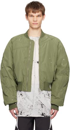 Padded polyester twill bomber jacket. Eyelets throughout. · Paneled construction · Rib knit stand collar, hem, and cuffs · Two-way zip closure · Flap pockets · Full taffeta lining Available exclusively at SSENSE. Supplier color: Khaki Urban Outerwear With Zip Cuffs For Spring, Modern Spring Outerwear With Zip Cuffs, Modern Outerwear With Ribbed Cuffs For Spring, Modern Spring Outerwear With Ribbed Cuffs, Spring Streetwear Outerwear With Zip Cuffs, Heliot Emil, Mens Outerwear, Color Khaki, Flap Pocket