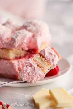 two pieces of cake on a plate with butter and cherry slices next to it,