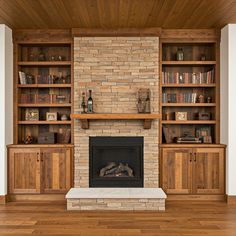 a living room filled with furniture and a fire place in front of a brick fireplace