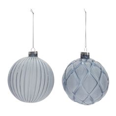 two blue glass ornaments hanging from strings