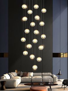 a living room filled with furniture and lots of lights hanging from it's ceiling