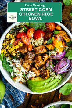 a white bowl filled with chicken and rice next to other food on top of a wooden table