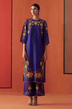 Cobalt blue chanderi kurta with multi-colored beads and floral applique embroidery. Comes with pant.
Components: 2
Pattern: Applique embroidered
Type Of Work: Beads, Floral
Neckline: Round
Sleeve Type: Flared Sleeves
Fabric: Chanderi, Lining : 100% Cotton
Color: Blue
Other Details: 
Attached lining
Model Height : 5 ft 6 inches, wearing size S
Occasion: Sangeet - Aza Fashions Embroidered Beads, Chanderi Kurta, Embroidered Kimono, Semi Casual, Embroidered Pants, Organza Dupatta, Kurta With Pants, Floral Applique, Pant Set