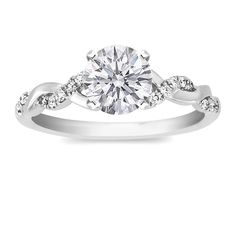 a white gold engagement ring with diamonds on it