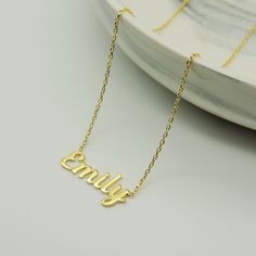 "14k Gold Name Necklace * Custom Name Necklace * Material : 14k Solid Gold - 8k Solid Gold * Finish : White Gold - Yellow Gold - Rose Gold * Production Method : Laser and handmade processes * Lenght: Adjustable Between 14 inch - 22 inch *Lowercase Height : 5 mm A Necklace that your neck will seriously loveee. This name necklace is perfect for everyday. * 100% Handmade for your size * All jewelry comes in beautiful packaging, gift ready. * All items are made to order in Turkey. * Our current proc Personalized Dainty 14k Gold Necklace, Gold Nameplate Necklace With Delicate Chain, Yellow Gold Custom Name Necklace For Everyday, Everyday 14k Yellow Gold Name Necklace, Minimalist Yellow Gold Custom Name Jewelry, Everyday Yellow Gold Custom Name Necklace, Custom Name Yellow Gold Minimalist Jewelry, Classic Gold Name Necklace With Delicate Chain, Gold Name Necklace For Everyday