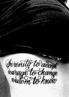 the back of a woman's stomach with an inscription on it that reads, serenity