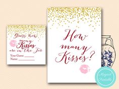 two greeting cards with gold glitter and pink flowers on them, one says how many kisses?