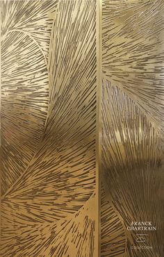 an artisticly designed metal door with gold paint