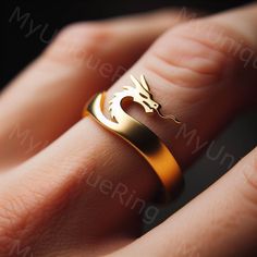 *Free engravings up to 20 characters* 🐉 Introducing our exquisite Gold Men's Ring with a Majestic Dragon Design! 🐉 👑 Elevate your style with this stunning piece, crafted with precision and passion. Made for the modern gentleman who appreciates mythical creatures and distinctive design. 🎩 🌟 Handcrafted from high-quality 10k gold, this ring boasts a sleek and polished finish that catches the eye and commands attention. 💫 💪 The subtle dragon design adds a touch of legendary charm, perfect for the man who embraces the power, wisdom, and mystery associated with these mythical beasts. ⚔️ 🎁 Whether it's a gift for yourself or a special someone, this ring is sure to make a statement and become a cherished addition to any jewelry collection. 💍 🚀 Don't settle for ordinary, embrace the extr Dragon Wedding, Majestic Dragon, Rings Mens Wedding Bands, Dragon Ring, Gold Dragon, Dragon Jewelry, Modern Gentleman, Dragon Design, Chinese Dragon