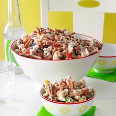 two bowls filled with cereal on top of a table