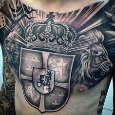 a man with tattoos on his chest has a crown and lions