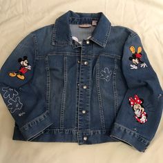 Chico’s; Mickey & Minnie Jean Jacket- Never Worn The Embroidery Was Just Added With A Few Mouse Holes Added And You Can Add Your Own. Glass Shiny Buttons With Medal Finish. This Is A Fun Jacket For Anyone Who ’S Mickey!! One Of A Kind Item, Not Sold In Stores And The Mouse Hole Are Free. Lol !! Chico’s Size 2 (8/10- M) Price Firm!! - Free Shipping!! Whose Going To Disney !! Go With Styling M&M Best Team Ever, Rocking It !! Blue Outerwear With Embroidered Patch For Fall, Fall Blue Outerwear With Embroidered Patch, Blue Long Sleeve Outerwear With Embroidered Patch, Blue Embroidered Long Sleeve Denim Jacket, Blue Denim Jacket With Embroidered Patch, Denim Long Sleeve Outerwear With Embroidered Patch, Casual Long Sleeve Outerwear With Machine Embroidery, Fitted Denim Jacket With Embroidered Patch And Long Sleeves, Fitted Outerwear With Embroidered Patch For Fall