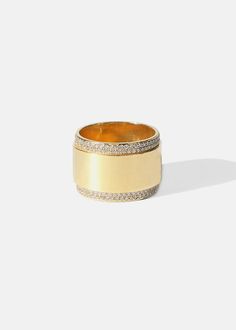 a gold ring with two rows of diamonds on the outside and inside, set against a white background