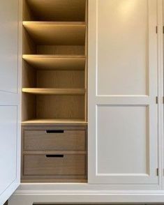 an open closet with drawers and lights