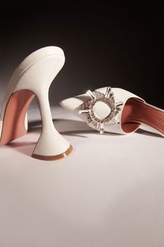 BEGUM MULE - Amina Muaddi - Official Site Amina Muaddi Bridal Shoes, Amina Muaddi White Heels, Designer White Leather Mules, Designer White Pointed Toe Mules, White Designer Mules With Pointed Toe, White Leather Mules For Formal Occasions, White Luxury Formal Mules, Luxury White Mules With Sculpted Heel, Designer White Formal Mules