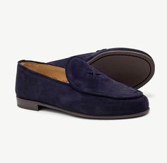 Our classic Navy Suede Milano Loafer, now in Women's sizing, is made with luxurious Italian suede and a custom rubber sole that looks as good as it feels. Size down half a size from your most common sneaker size Handmade in Italy Suede exterior with red stitching on heel Leather lining and cushioned leather footbed Rubber sole for traction and all-day comfort Modern Formal Slip-ons With Suede Lining, Modern Slip-on Loafers For Galas, Luxury Tassel Loafers With Suede Lining For Business, Modern Almond Toe Loafers For Galas, Modern Round Toe Loafers For Galas, Modern Slip-on Tassel Loafers With Leather Sole, Modern Formal Loafers With Suede Lining, Luxury Tassel Loafers With Stitched Sole For Galas, Modern Tassel Loafers With Leather Sole