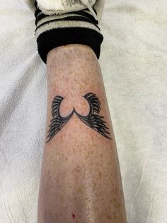 a person with a tattoo on their arm