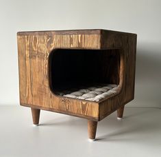 a small wooden oven with some bread in it