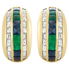 These Bvlgari earrings have a symphony of diamonds alongside a captivating row of alternating emeralds and sapphires. There are 12 square buff top sapphires that weigh approximately 2.00 carats. There are 8 square buff top emeralds that weigh approximately 1.20 carats. There are 44 baguette diamonds that weigh approximately 2.00 carats; they are F-G color and VS clarity. Signed Bvlgari, made in Italy. Bvlgari Earrings, Earrings For Sale, Sapphire Earrings, Baguette Diamond, Gold Diamond, Emerald, Sapphire, Jewelry Earrings, Yellow Gold