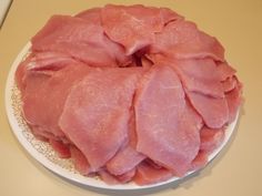 raw meat on a plate ready to be cooked