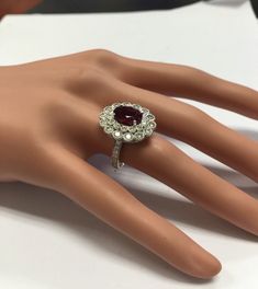 4.25 Carats Natural Very Nice Looking Tourmaline and Diamond 14K Solid White Gold Ring Suggested Replacement Value: $8,300.00 Total Natural Oval Cut Tourmaline Weight is: 2.50 Carats Natural Round Diamonds Weight: 1.75 Carats (color G-H / Clarity SI1-SI2) Ring total weight: 7.5 grams Disclaimer: all weights, measurements and colors are approximate and may vary slightly from the listed dimensions or as seen in the image. All pictures are magnified to show the smallest of details. Please, refer to Luxury Tourmaline Jewelry With Halo Setting, Luxury Ruby Cluster Ring With Center Stone, Luxury Cluster Ruby Ring With Center Stone, Platinum Ruby Ring With 17 Jewels, Luxury Tourmaline Rings With Halo Setting, Luxury Ruby Ring With Multi-stone Round Cut, Luxury Round Cut Multi-stone Ruby Ring, Luxury Multi-stone Round Cut Ruby Ring, Formal Ruby Gemstones