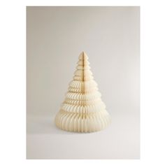 a white ceramic christmas tree on a white background