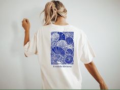 The 100% cotton unisex classic tee will help you land a more structured look. It sits nicely, maintains Product Description: Embrace the essence of summer with our stylish t-shirt featuring the elegant "French Riviera" print. Perfect for beach outings, casual gatherings, or relaxed days at home, this t-shirt combines chic design with ultimate comfort. Key Features Elegant Design: The sophisticated "French Riviera" print brings a touch of French charm and summer vibes to your wardrobe Premium Qua French Riviera Design, Clothing Graphics, French Riviera, Look Plus, Summer Tshirts, The Chic, Chic Design, Piece Of Clothing, Summer Collection