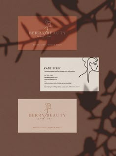 three business cards with the name berry beauty written on them, and one has a woman's face