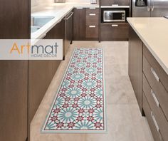 a kitchen with an area rug on the floor and cabinets in the backround