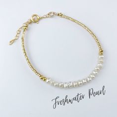 This beautiful freshwater pearl gemstone bracelet is handcrafted with 4mm natural freshwater pearls. The gold beading is done with high quality Japanese Miyuki Duracoat delica seed beads. The larger round gold beads are 14k gold filled for lasting quality. A 14k gold filled spring clasp completes the look. It's the perfect bracelet for layering or wearing all on its own! It's simple, yet elegant design makes it a great option for every day wear. This bracelet can be purchased in either 14k gold Gold Hand-strung Pearl Necklace With Round Beads, Gold Hand-strung Pearl Necklace For Gift, Gold Pearl Necklace Gift, Elegant Pearl Beaded Bracelets With Tiny Beads, Elegant Pearl Beaded Bracelet With Tiny Beads, Pearl Bracelets With Gold Beads As A Gift, Adjustable Pearl Necklace With Gold Beads, Pearl White Bracelet With Gold Beads As Gift, Pearl White Bracelet With Gold Beads For Gift