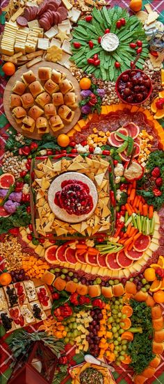 a table covered in lots of different types of food and fruit on top of it