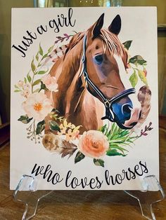 a horse with flowers around it and the words, just a girl who loves horses