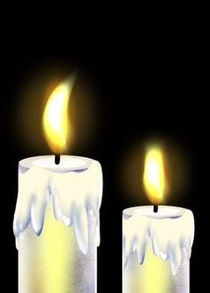 two lit candles with white icing on them