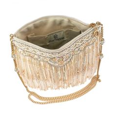 Layers of beaded fringe and faceted crystals create a beautiful bag that is ready to shimmy and shake on the dance floor or walk down the aisle. The elegant craftsmanship makes this crossbody handbag as unforgettable as your big day!Product Deatails 9" x 1.25" x 7" Strap Length End to End: 49" Strap Drop: 23" Removable crossbody chain strap, zipper closure, inside pocket, metal logo fob, protective storage bag, certificate of authenticity, fits a phone This is a handmade item, each one an indivi Dimensional Wall Decor, Walk Down The Aisle, Headpiece Jewelry, Mary Frances, Timeless Classic Style, On The Dance Floor, Crossbody Clutch, Beaded Fringe, Metal Logo