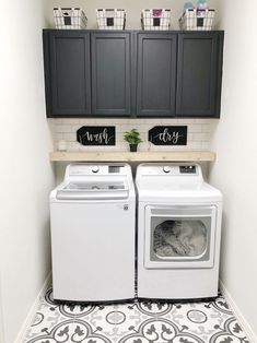 a white washer and dryer sitting next to each other in a laundry room