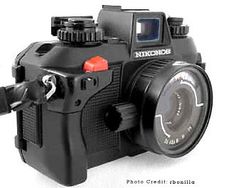 an image of a camera that is on the white background with words above it reading nikon's photo credit bubbaella