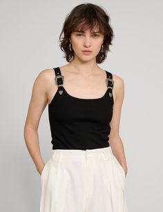 Black ribbed tank top with decorative western belt shoulder straps . Brand Pixie Market98% cotton, 2% elastaneRuns true to sizeModel is wearing size smallLength 21"Dry clean onlyImported Cotton Tank Top For Night Out, Edgy Tank Top With Tank Straps For Summer, Edgy Tank Top With Tank Straps For Spring, Pixie Market, Trendy Tops For Women, Western Belt, Ribbed Tank Top, Western Belts, Ribbed Tank Tops