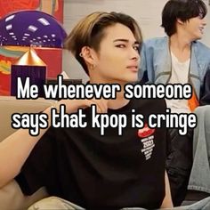 two people sitting on a couch with the caption me whenever someone says that kpop is cringe