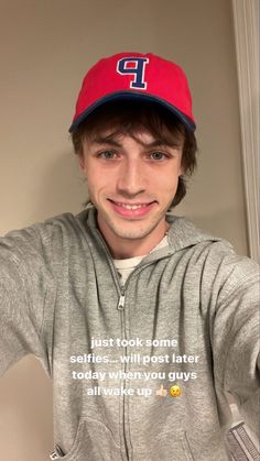 a young man wearing a red and blue baseball cap with the words, just took some selfies will post later today when you guys all value up