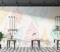 an ice cream shop with tables and chairs in front of a wall painted with pastel colors