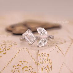 an engagement ring with two pear shaped diamonds