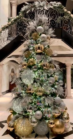 a decorated christmas tree in the middle of a room